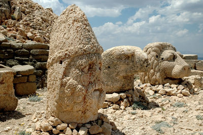 Damaged stone sculptures at nemrud dagh