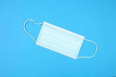 Directly above shot of book against blue background