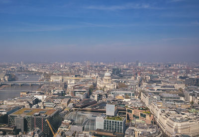 High angle view of city buildings against sky