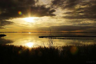 Scenic view of lake against sky during sunset