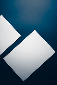 High angle view of paper against blue sky