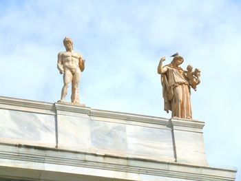 Low angle view of statue against sky