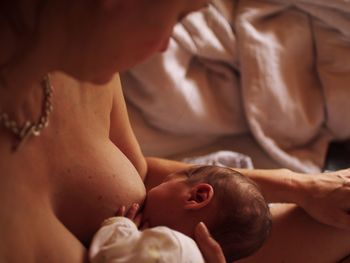 Close-up of woman breastfeeding