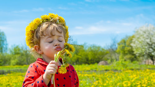 Portrait of young woman holding flower