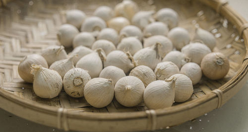 High angle view of peanuts in bowl on table