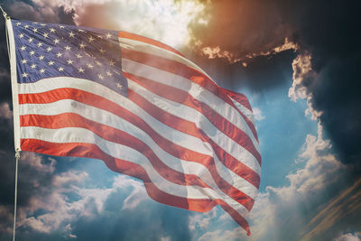 Low angle view of flag against sky