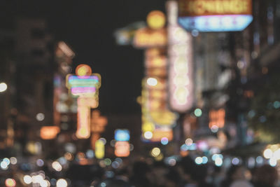 Defocused image of illuminated city at night