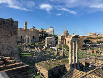 Forum romanum in rome, italy. in a distance colosseum.