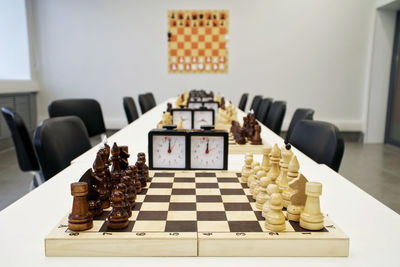 Chess pieces over board on table