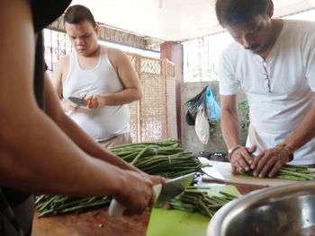 Man preparing food on cutting board