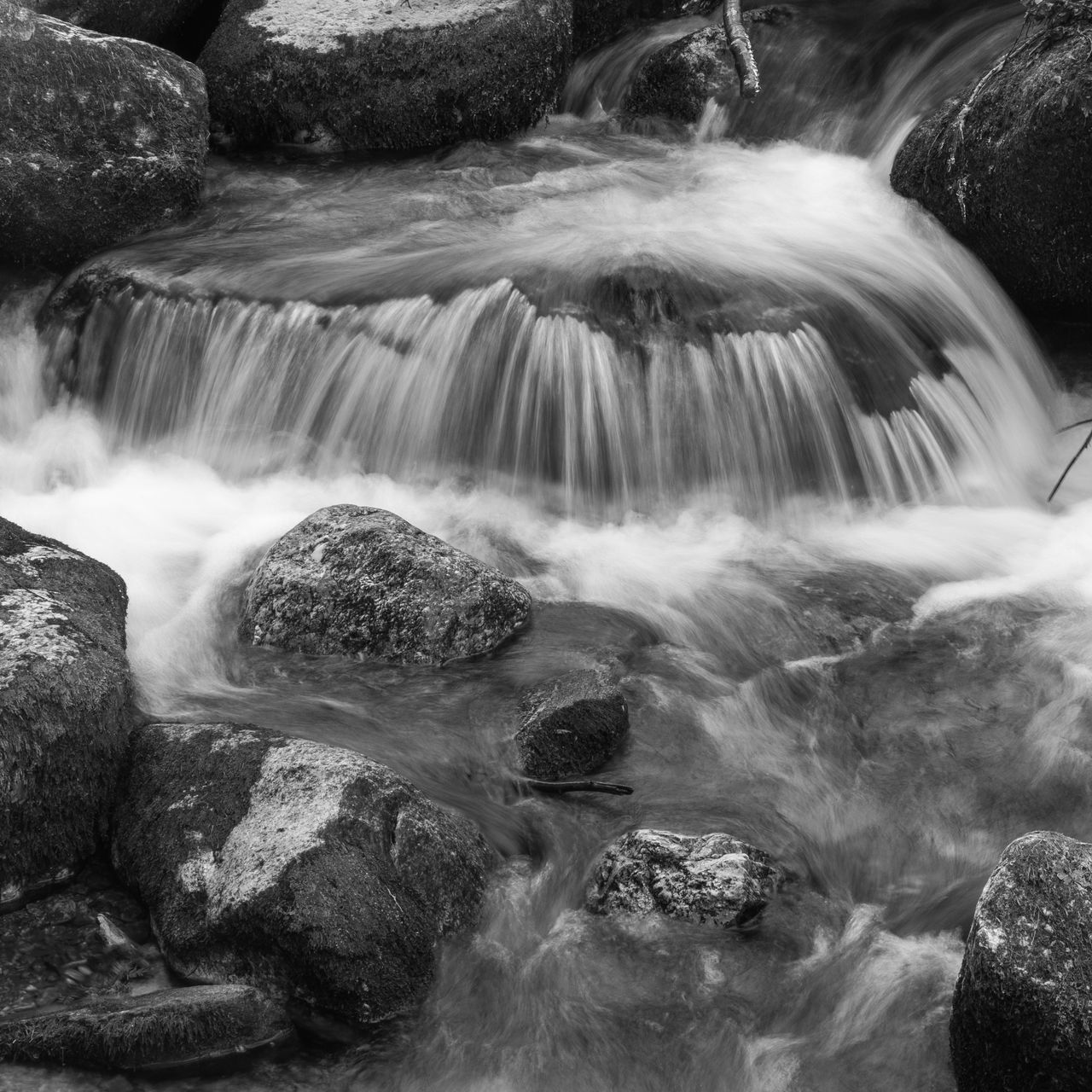 VIEW OF WATERFALL WITH ROCKS