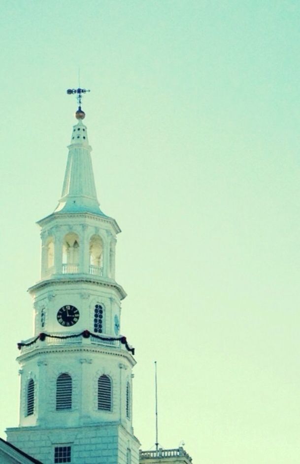 architecture, building exterior, built structure, low angle view, clear sky, copy space, tower, blue, religion, tall - high, high section, church, place of worship, travel destinations, clock tower, day, famous place, travel, outdoors