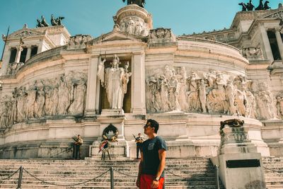 Low angle view of statue against building