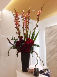 Close-up of flower vase on table at home