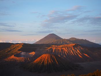 Scenic view of mountain range against sky during sunset