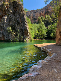 Scenic view of sea and mountains against sky
