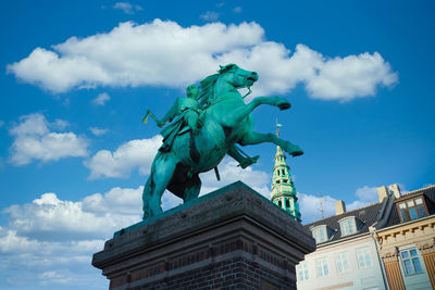 Low angle view of statue of liberty against sky