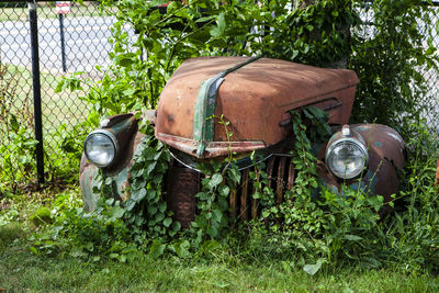 Old abandoned truck on field