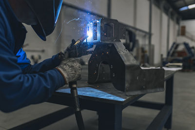 Welder welding machine part in factory