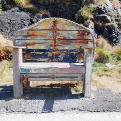 Old abandoned bench on rock