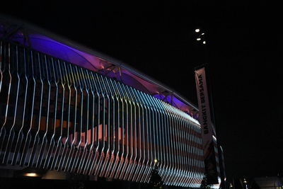 Low angle view of illuminated built structure at night