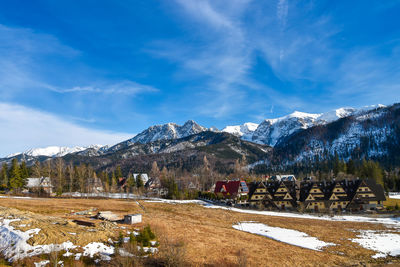 View from the koscielisko valley to the panorama of the tatra mountains. beautiful winter landscape.