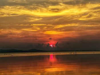 Scenic view of sea against romantic sky at sunset