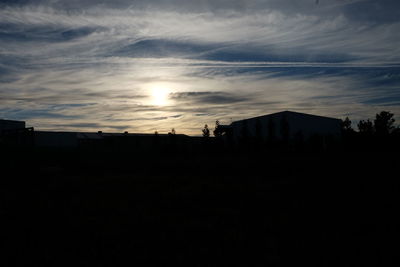 Scenic view of silhouette mountains against sky during sunset