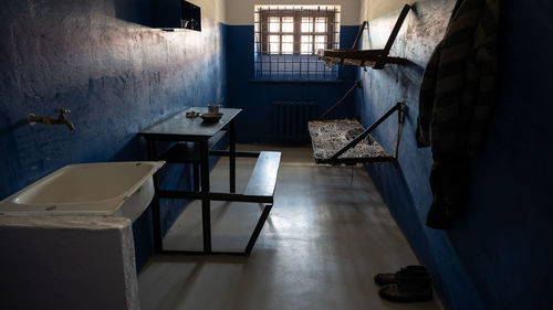 Empty chairs and tables in building