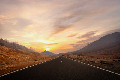 Scenic view of mountains against sky during sunset