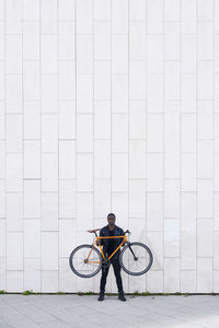 Man holding his bike