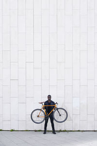 Man holding his bike
