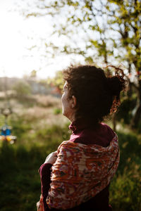 Side view of woman standing on land