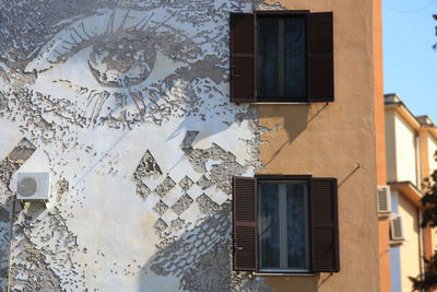 Old building in rome, with eye carved on the wall. street art and graffiti concept 