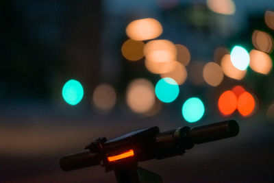 Close-up of bicycle handle at night