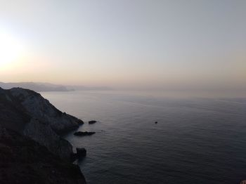 Scenic view of sea against clear sky during sunset