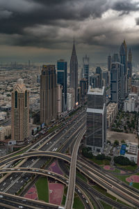 High angle view of illuminated cityscape against sky