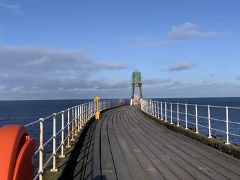 Pier over sea against sky