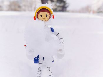 Stuffed toy on snow during winter