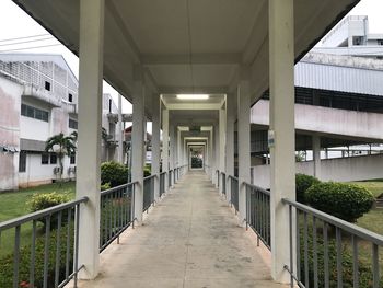 Footpath amidst buildings in city