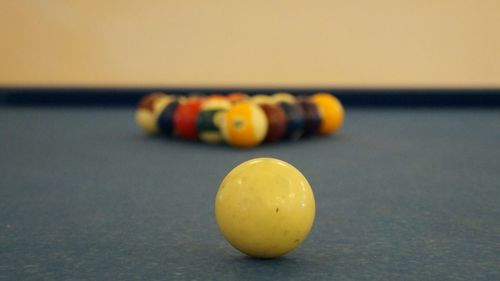 Close-up of yellow ball on table