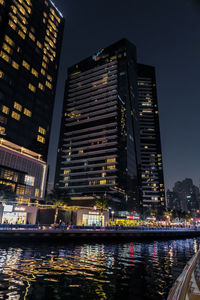 Illuminated buildings in city at night