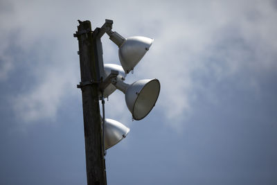 Close up of field lights in partially cloudy weather