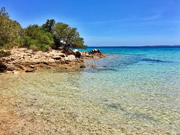 Scenic view of sea against clear blue sky