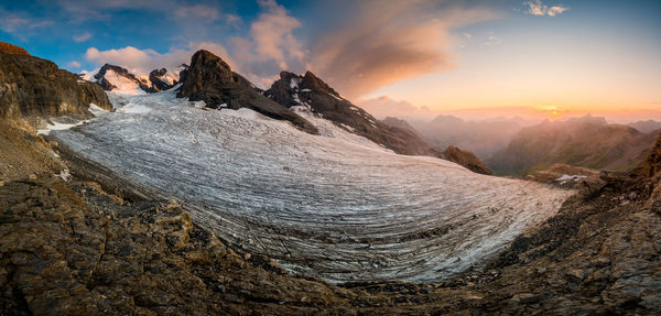 Panoramic view of mountains against sky during sunset