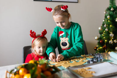 High angle view of girl playing with toys on table