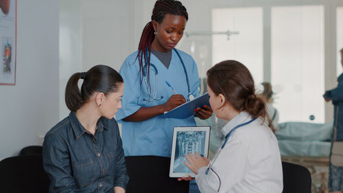 Female doctor showing medical x-ray