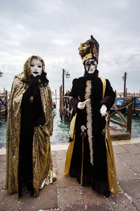 People wearing costume and mask during venice carnival