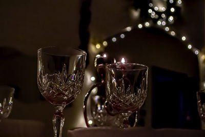 Close-up of wine glasses on table