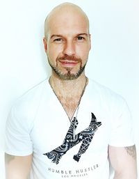 Portrait of smiling man against white background